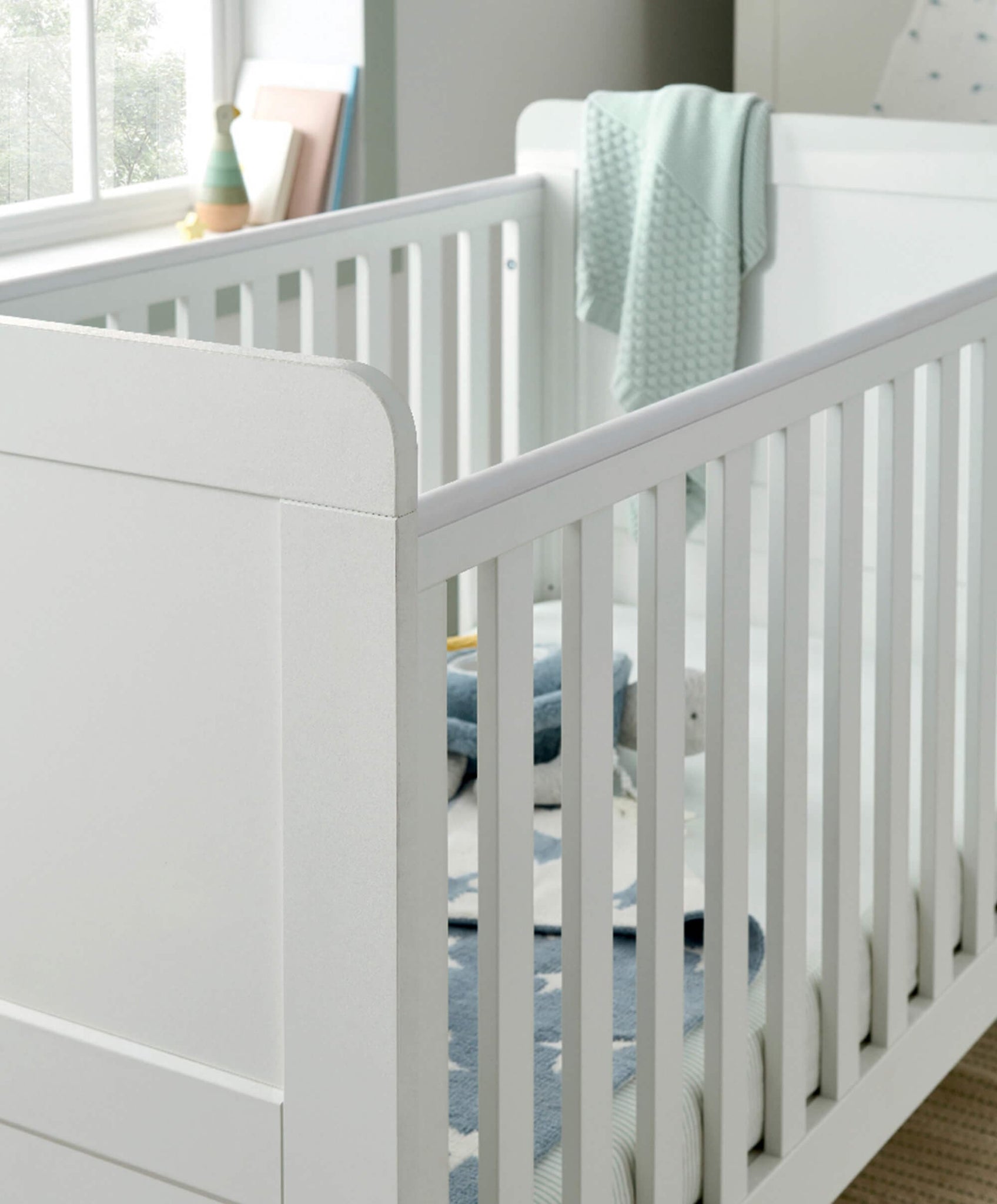 Grey and white cot bed hotsell